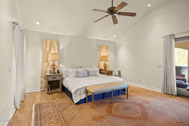 bedroom with high vaulted ceiling, light hardwood / wood-style floors, and ceiling fan