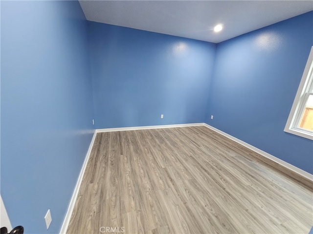 empty room featuring wood-type flooring