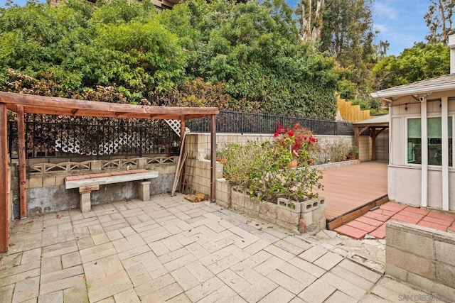 view of patio featuring a wooden deck and a gazebo