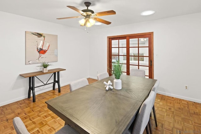 dining area featuring light parquet floors and ceiling fan