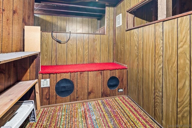 interior space featuring wood walls