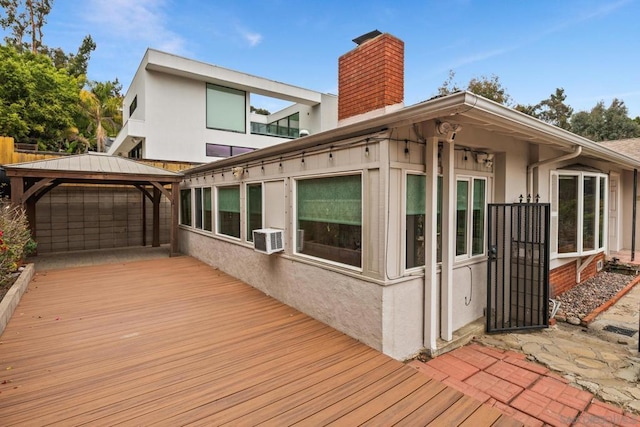 back of house with a gazebo