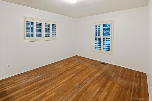 unfurnished room featuring wood-type flooring