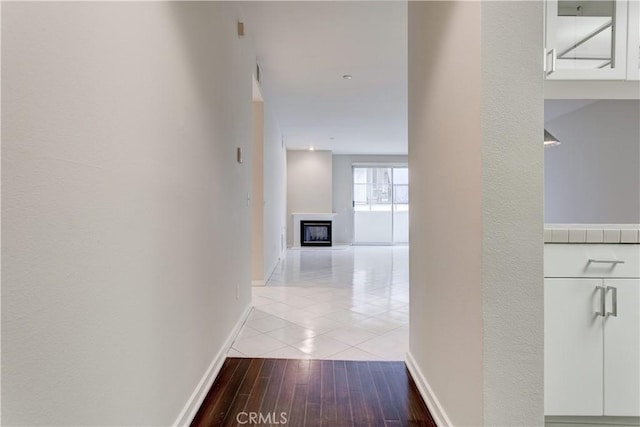 hall with light hardwood / wood-style floors