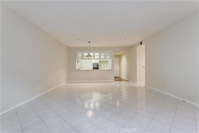 empty room with light tile patterned flooring