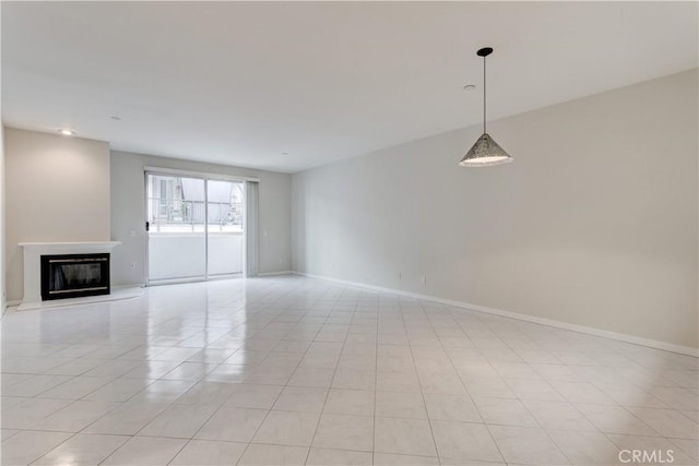 unfurnished living room featuring light tile patterned floors