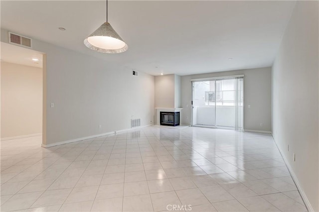 unfurnished living room with light tile patterned floors