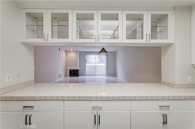 kitchen featuring white cabinets