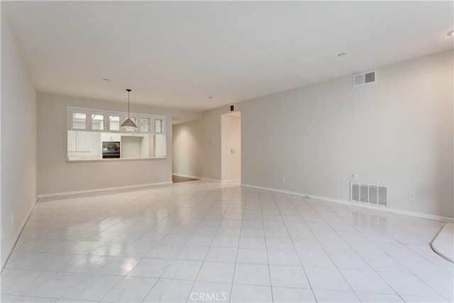 empty room with light tile patterned floors