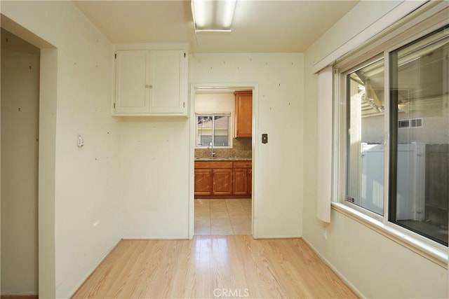 hallway with light wood-type flooring