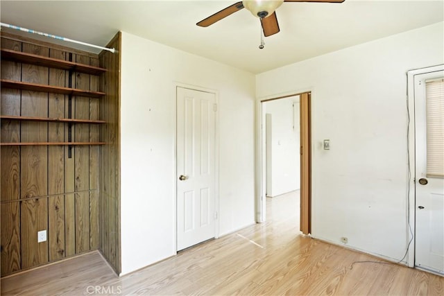 unfurnished bedroom featuring light hardwood / wood-style floors and ceiling fan