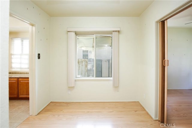 unfurnished room with light hardwood / wood-style flooring