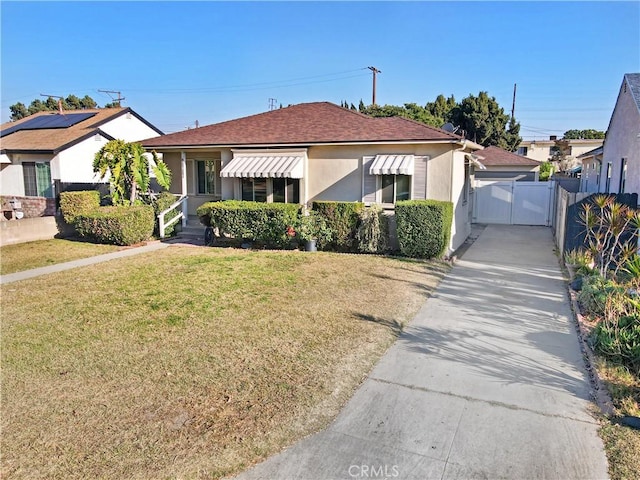 bungalow featuring a front yard