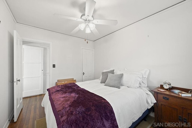 bedroom featuring dark wood-type flooring and ceiling fan