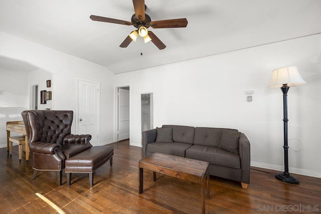 living room with lofted ceiling, dark wood-type flooring, and ceiling fan