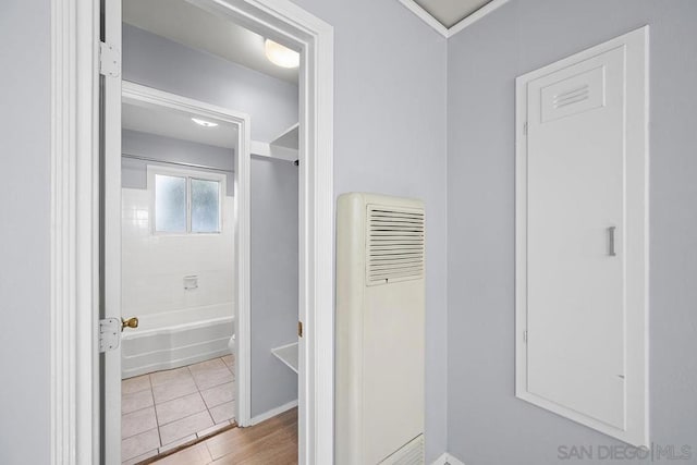 bathroom with tiled shower / bath combo and tile patterned floors