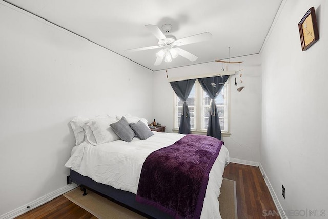 bedroom featuring ceiling fan and dark hardwood / wood-style flooring