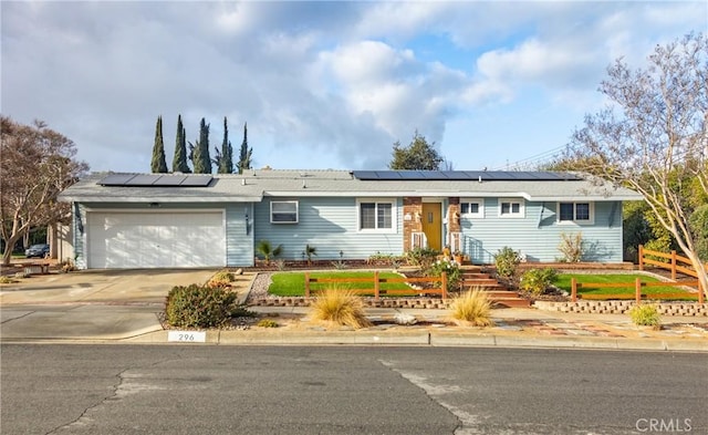 ranch-style house featuring a garage