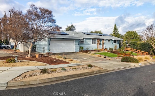 single story home featuring a garage and solar panels