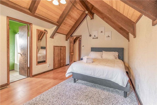 bedroom with wood ceiling, light hardwood / wood-style floors, and vaulted ceiling with beams