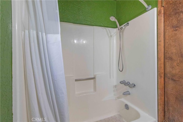 bathroom featuring shower / tub combo with curtain