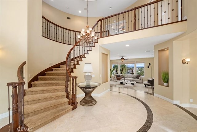 entrance foyer with marble finish floor, recessed lighting, and baseboards