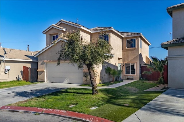 mediterranean / spanish-style house featuring stucco siding, a front lawn, driveway, and fence