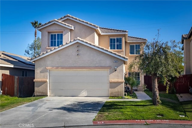 view of front of house featuring stucco siding, fence, concrete driveway, a front yard, and a tiled roof