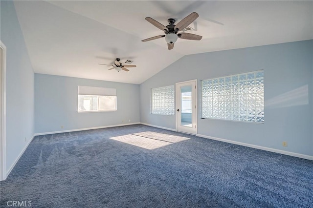spare room featuring ceiling fan, carpet flooring, baseboards, and lofted ceiling
