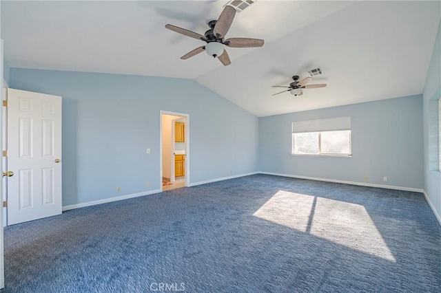 unfurnished bedroom with visible vents, baseboards, carpet, and vaulted ceiling