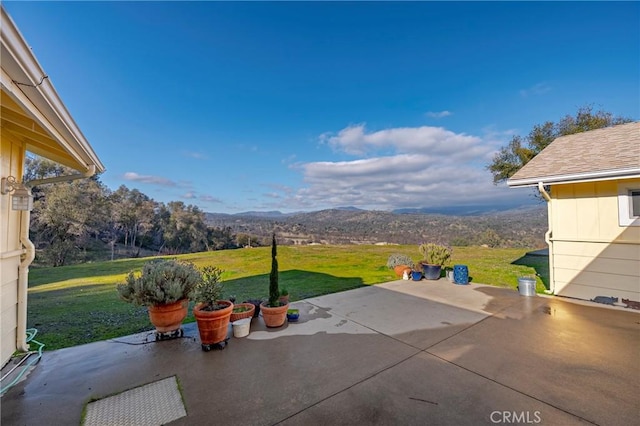 view of patio / terrace with a mountain view