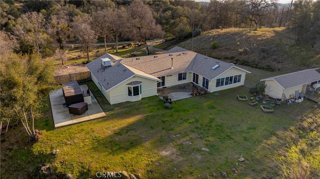 birds eye view of property with a forest view