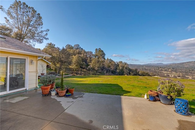 view of patio / terrace featuring a mountain view