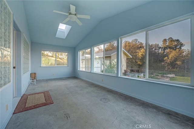 unfurnished sunroom with lofted ceiling with skylight and a ceiling fan