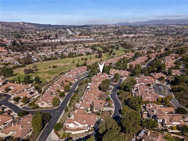 birds eye view of property with a mountain view