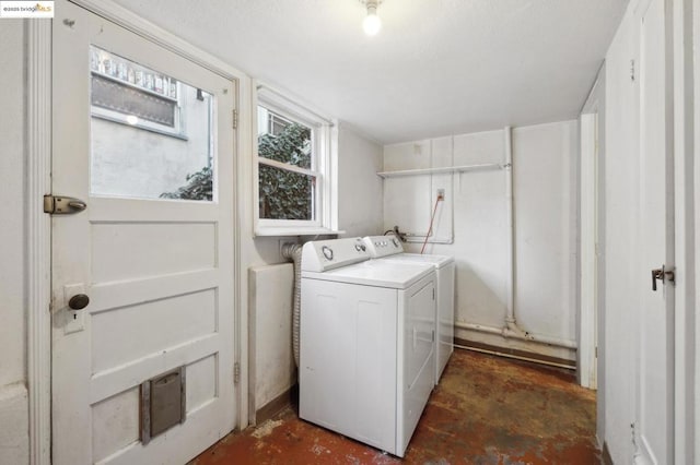 laundry area with independent washer and dryer