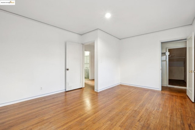 spare room featuring light wood-type flooring