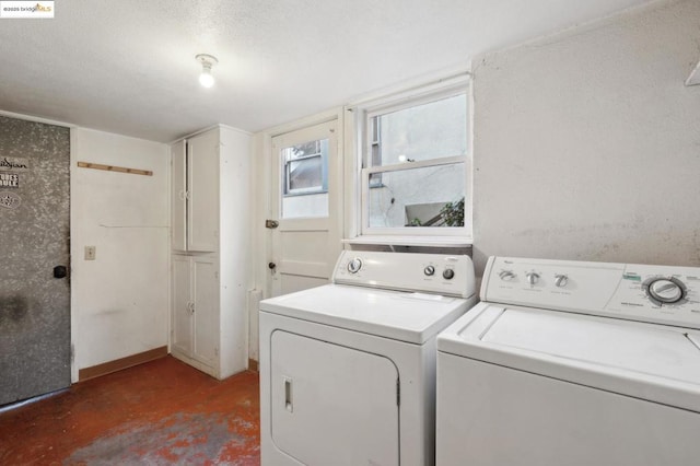 laundry area featuring washing machine and clothes dryer