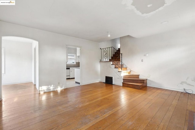 unfurnished living room with light wood-type flooring