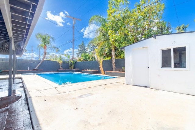 view of swimming pool with a patio