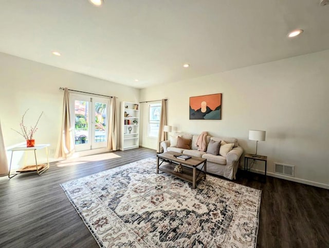 living room featuring dark hardwood / wood-style flooring