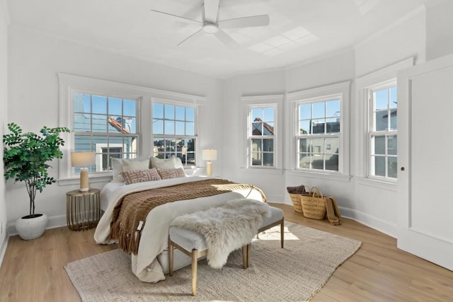 bedroom featuring ceiling fan and light hardwood / wood-style flooring