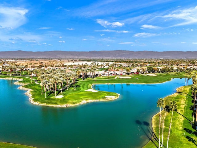 drone / aerial view with a water and mountain view