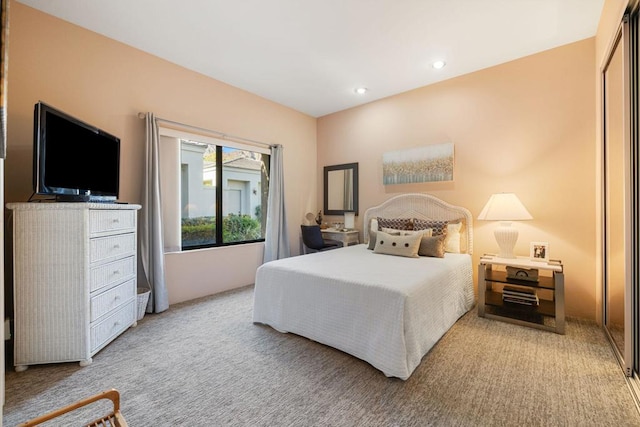 bedroom with light colored carpet