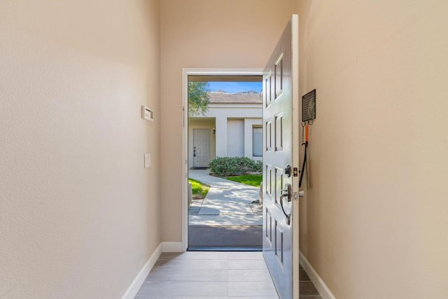 entryway featuring light tile patterned floors