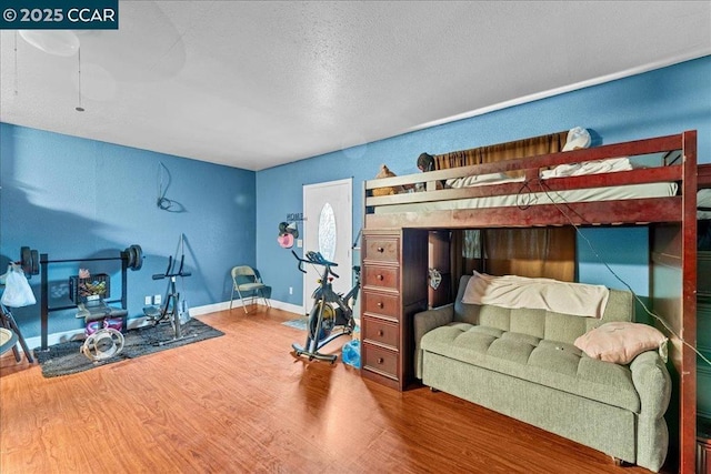 bedroom featuring hardwood / wood-style floors