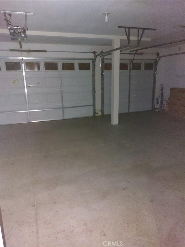 garage featuring a garage door opener