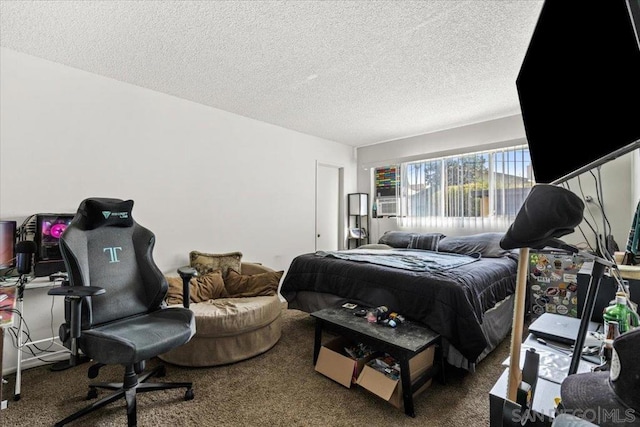 bedroom featuring carpet flooring and a textured ceiling