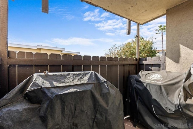 exterior space with a balcony and a grill