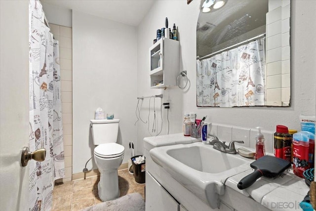 bathroom with vanity, toilet, and walk in shower